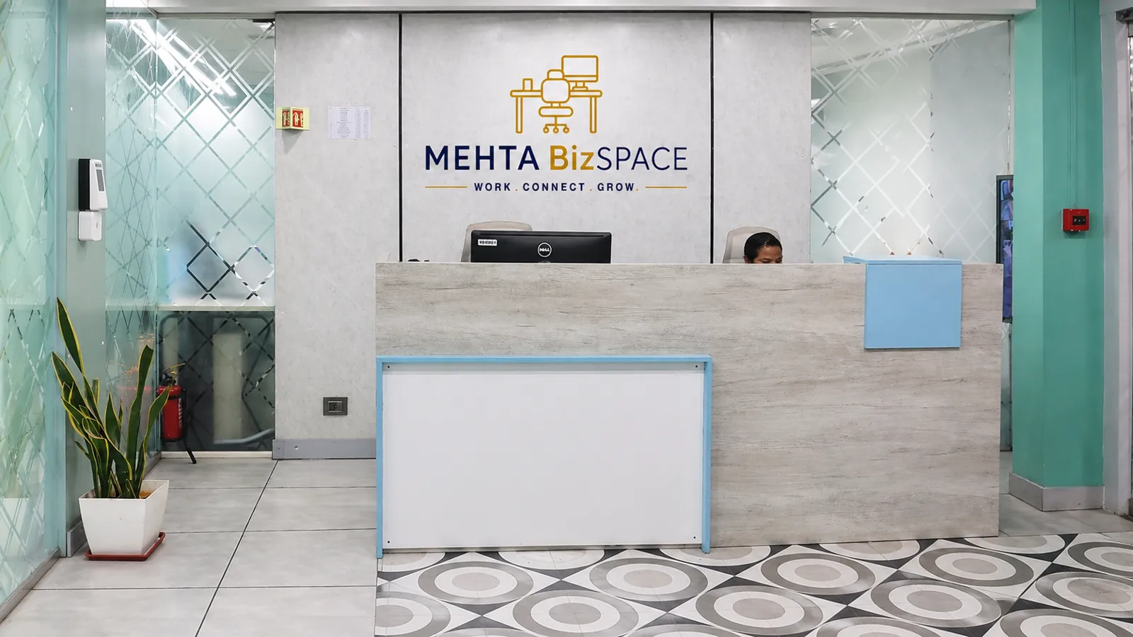 Staffed reception desk at Mehta Biz Space, 5th floor, Brigade Plaza, Gandhi Nagar, Bengaluru